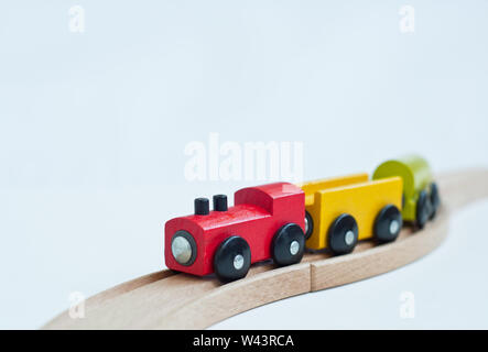 Wooden toy train with colorful blocks.  Educational toys. Stock Photo