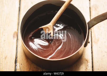 Preparing chocolate sauce in pot Stock Photo