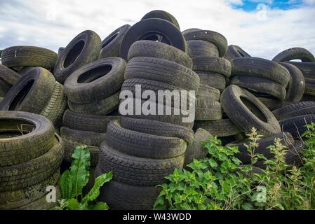 Ageing tyres dumped in rural area of Scotland.