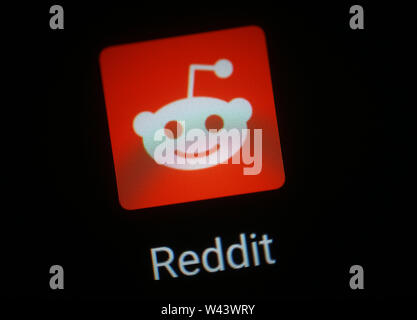 Reddit application icon on computer display Stock Photo