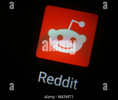 Reddit application icon on computer display Stock Photo