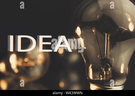 Light bulb shining in the darkness Stock Photo