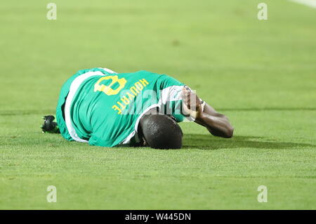 Cairo, Egypt. 19th July, 2019. Senegal's Cheikhou Kouyate lies injured on the ground during the 2019 Africa Cup of Nations final soccer match between Senegal and Algeria at the Cairo International Stadium. Credit: Omar Zoheiry/dpa/Alamy Live News Stock Photo