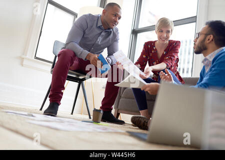 Multi-ethnic team of creative millenials collaborating on a brainstorm project Stock Photo