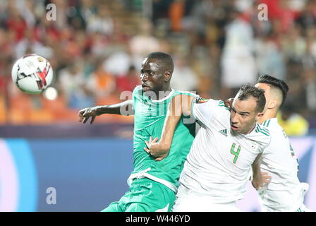 Cairo, Egypt. 19th July, 2019. Algeria's Djamel Benlamri and Senegal's Cheikhou Kouyate battle for the ball during the 2019 Africa Cup of Nations final soccer match between Senegal and Algeria at the Cairo International Stadium. Credit: Omar Zoheiry/dpa/Alamy Live News Stock Photo