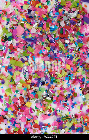 Shredded colorful paper confetti background. Different color small