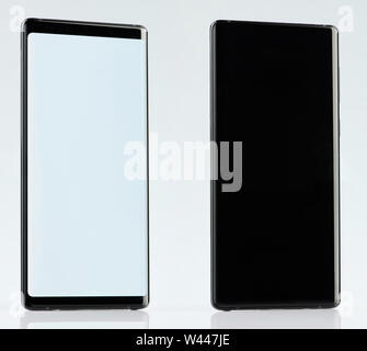 Back and front view of black generic smartphone isolated on white background Stock Photo