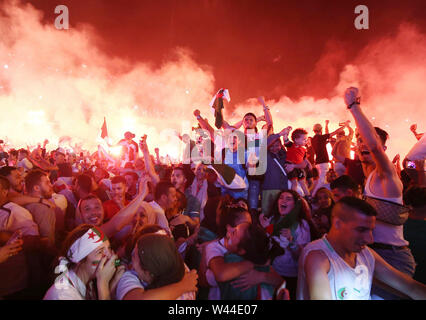 Algiers. 20th July, 2019. Algerian fans celebrate the team's victory in Africa's Cup of Nations in Algiers, Algeria, July 19, 2019. Algeria beat Senegal in Africa's Cup of Nations final by 1-0 and claimed the title of the event in Egypt's Cairo July 19. Credit: Xinhua/Alamy Live News Stock Photo