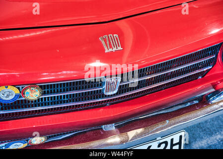 FRIEDRICHSHAFEN - MAY 2019: logo emblem of red FIAT OSI 1200 SPYDER 1965 COUPE at Motorworld Classics Bodensee on May 11, 2019 in Friedrichshafen, Ger Stock Photo