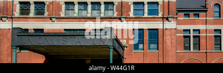 A narrowly cropped panamormic view of the Union Station's signage on the metal covered overhang of the building's entrance , in Montgomery, AL, USA, Stock Photo