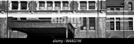 A narrowly cropped panoramic view of the Union Station's signage on the metal covered overhang of the building's entrance, in Montgomery, AL, USA, Stock Photo