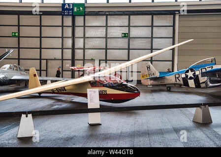 FRIEDRICHSHAFEN - MAY 2019: white red glider plane KA 7 1962 at Motorworld Classics Bodensee on May 11, 2019 in Friedrichshafen, Germany. Stock Photo