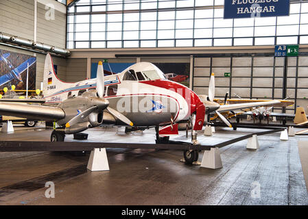 FRIEDRICHSHAFEN - MAY 2019: silver white red plane DE HAVILLAND DH-104 DOVE 8 D-INKA 1945 at Motorworld Classics Bodensee on May 11, 2019 in Friedrich Stock Photo