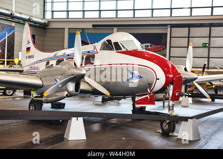 FRIEDRICHSHAFEN - MAY 2019: silver white red plane DE HAVILLAND DH-104 DOVE 8 D-INKA 1945 at Motorworld Classics Bodensee on May 11, 2019 in Friedrich Stock Photo