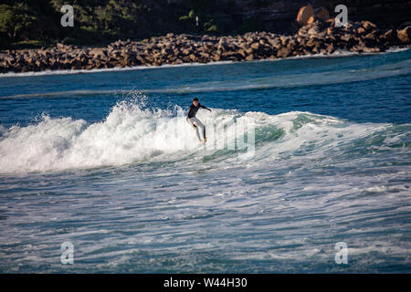 Man surfing riding the wave Avalon beach Sydney Australia Stock Photo