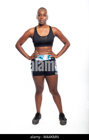 Athletic African American black female wearing workout clothing. Her sporty  outfit is a sports bra and form fitting spandex shorts. She looks strong  Stock Photo - Alamy
