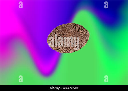 Natural pumice stone with for spa and bathroom on a trendy neon background. Stock Photo
