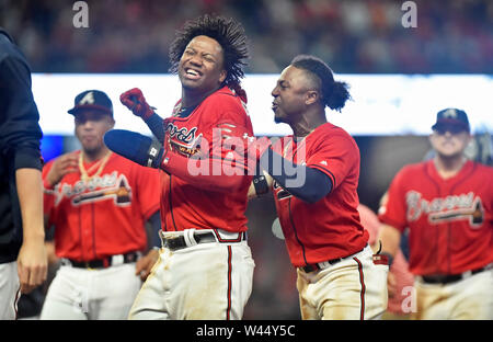 Atlanta, GA, USA. 04th July, 2019. Atlanta Braves shortstop Dansby Swanson  (left) kisses the head of infielder Ozzie Albies (right) after hitting an  eighth inning home run during a MLB game against