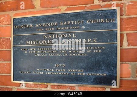 A bronze dedication plaque at the Dexter Avenue King Memorial Baptist Church on a red brick wall in Montgomery, AL, USA Stock Photo