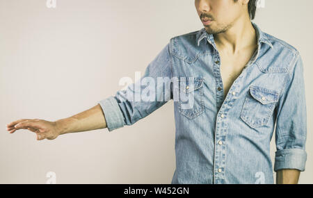 Jeans Shirt or Denim Shirt Man Fashion Front View. Jeans shirt or denim shirt fashion for men on grey background Stock Photo