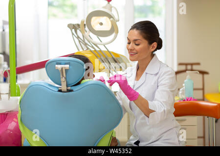 Attractive young female doctor examining x-ray results Stock Photo - Alamy