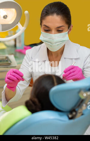 African American girl sitting on a medical examination Stock Photo