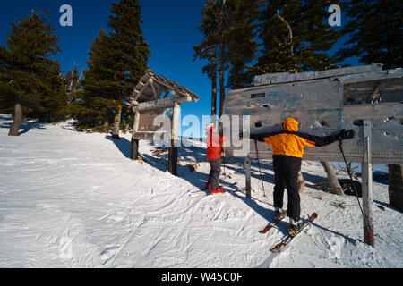 Skiers rub the wing fragment of the B-24 that crashed on Mission Ridge for good luck and to ensure it snows a lot. Many perform this ritual every run. Stock Photo