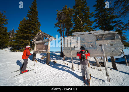 Skiers rub the wing fragment of the B-24 that crashed on Mission Ridge for good luck and to ensure it snows a lot. Many perform this ritual every run. Stock Photo