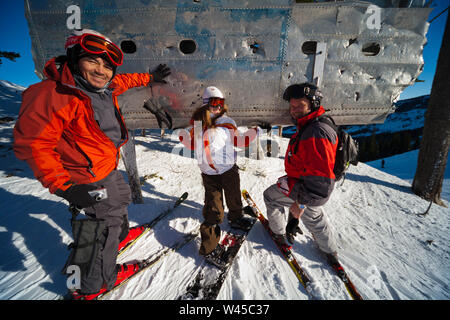 Skiers rub the wing fragment of the B-24 that crashed on Mission Ridge for good luck and to ensure it snows a lot. Many perform this ritual every run. Stock Photo