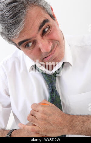 Businessman opening a pill bottle Stock Photo