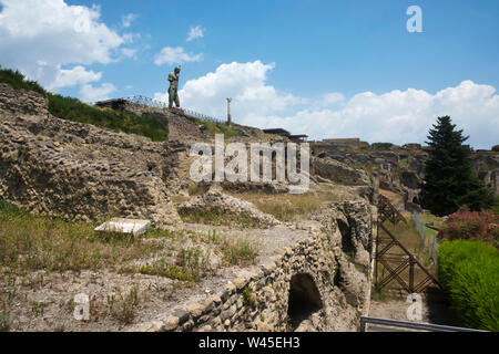 General view of the remains and bronze statue at an elevation, Pompeii, Italy. Stock Photo