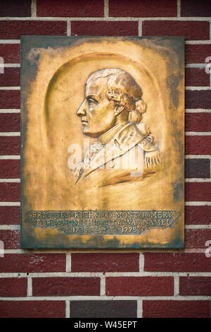 A bas relief portrait in metal as plaque on a red brick wall memorializing Brigadier General Richard Montomery, for whom the city of Montgomery, AL wa Stock Photo