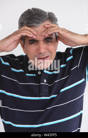 Man suffering from headache Stock Photo