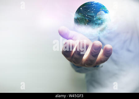 Protect our world in human hands and nebula dust. Mixed media. Stock Photo