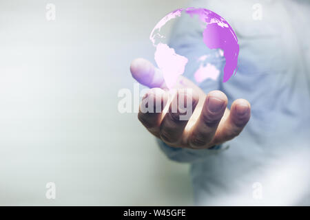 Protect our world in human hands and nebula dust. Mixed media. Stock Photo