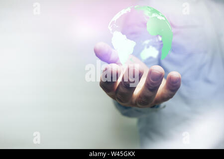 Protect our world in human hands and nebula dust. Mixed media. Stock Photo