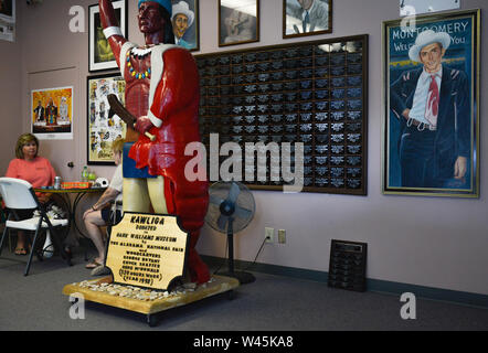 Interior of the Hank Williams Museum with framed photos and posters and large wooden native American gift in downtown Montgomery, AL, USA Stock Photo