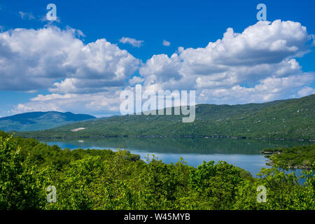 Montenegro, Lake krupac, a artificial lake next to niksic city surrounded by green trees and forest nature landscape reflecting in silent water with b Stock Photo