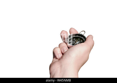 Female hand holding fingers compass pointing north. Isolated on white background Stock Photo