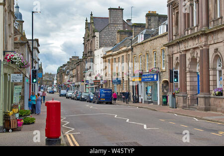 FORRES MORAY SCOTLAND LOOKING DOWN THE HIGH STREET TO SHOPS Stock Photo