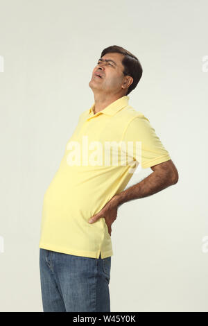 Man suffering from lower back pain Stock Photo