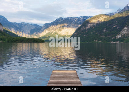 Alpine mountain range with lake in summer in Hallstatt, Austria Stock Photo