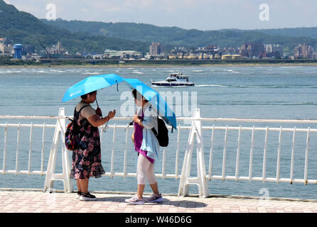 Taipei. 20th July, 2019. People visit a dock along the Tamsui River in southeast China's Taiwan, July 20, 2019. Credit: Zhu Xiang/Xinhua/Alamy Live News Stock Photo