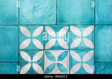 Shabby blue square tile on floor. Turkish or moroccan vintage style ornament. Empty textured background. Modern interior design. Stock Photo