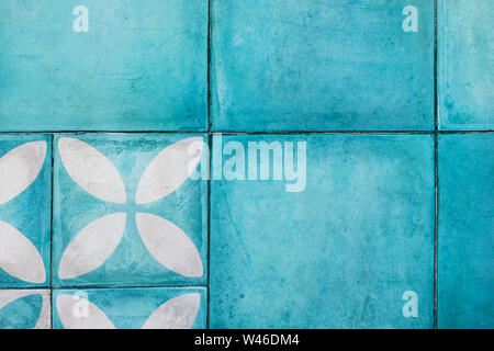 Shabby blue square tile on floor. Turkish or moroccan vintage style ornament. Empty textured background. Modern interior design. Stock Photo