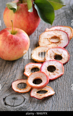 Dried apple rings on a wooden table Stock Photo