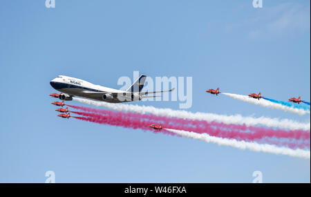 RAF Fairford, Gloucestershire, UK. 20th July 2019. Royal International Air Tattoo Flypast, with the Royal Air Force Red Arrows and British Airways 747 callsign 'BA100' Credit: Bob Sharples/Alamy Live News Stock Photo