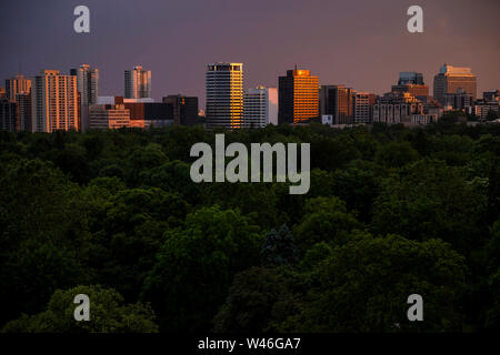 The downtown Toronto skyline seen over Mount Pleasant Cemetery at sunset in Toronto, Ontario, Canada Stock Photo