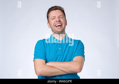 Portrait of a handsome young man laughing Stock Photo