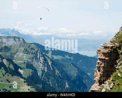 Paragliding in the swiss alps, Switzerland Stock Photo